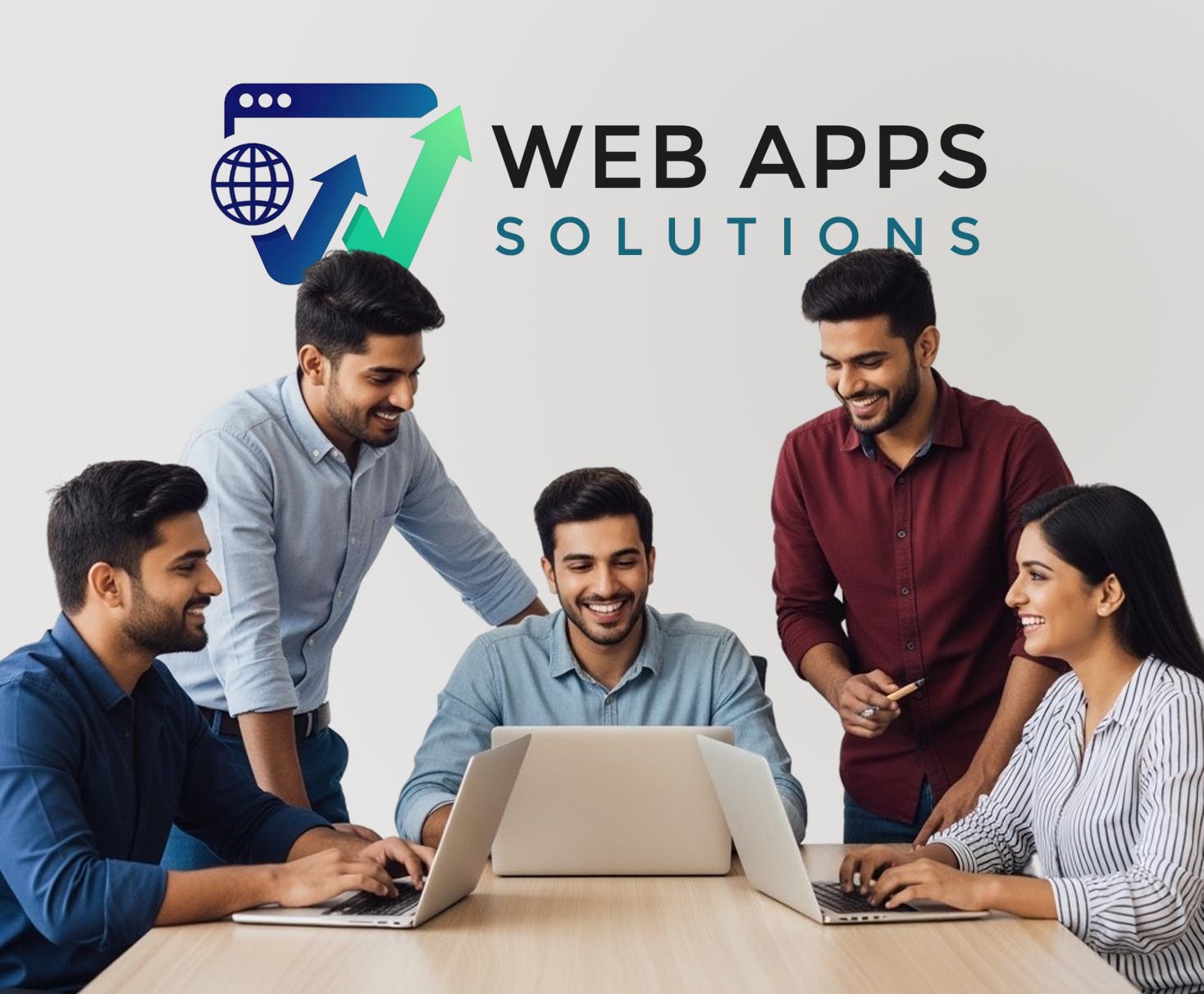 Team collaborating around a laptop in a modern office
